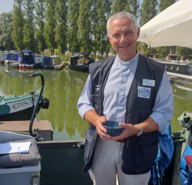 Blessing a narrowboat by a Waterways Chaplain