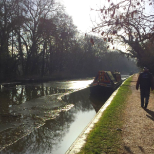 Chaplain walking down the towpath of an icy canal